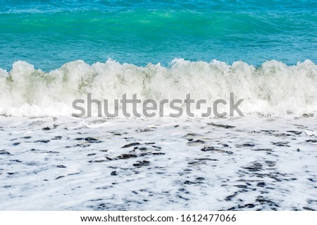 Beautiful waves foaming, water swallow as a background.