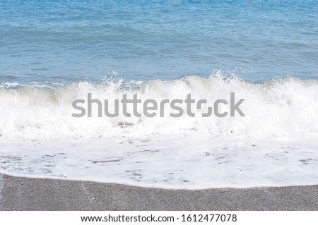 Beautiful waves foaming, water swallow as a background.