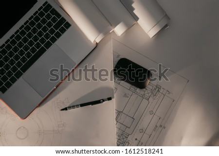 Engineering drawings and side light, protractor, notebook, term 