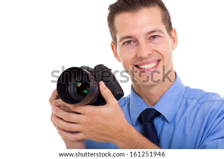 cheerful photographer holding a DSLR camera isolated on white