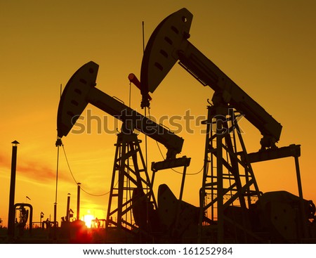 Oil Pump on orange sunset 