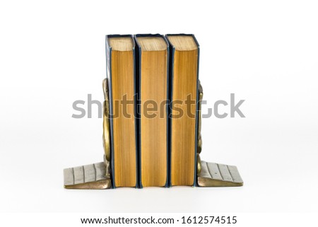 Antique Books between old Bookends white background