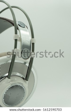 White and silver studio headphones for music producers. Mixing. On a white isolated background. Copy paste. Music Concept