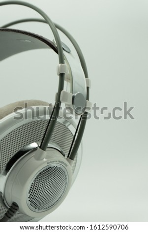White and silver studio headphones for music producers. Mixing. On a white isolated background. Copy paste. Music Concept