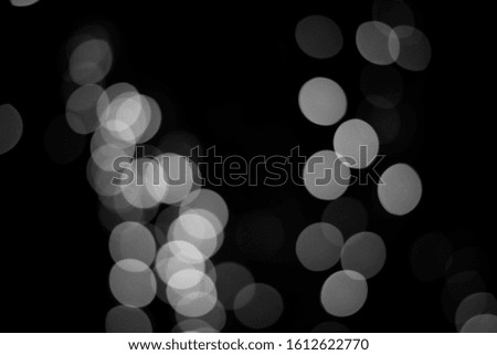 Abstract white bokeh on a black background, design for you