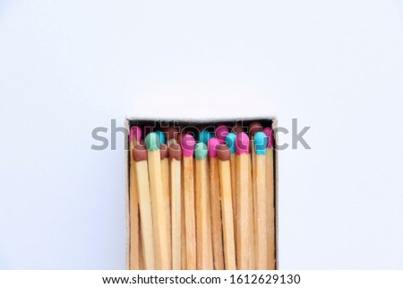 Сolorful matches in matchbox isolated on white background. Top view. Royalty-Free Stock Photo #1612629130