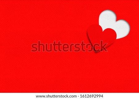 Heart carved on red paper background.  Valentines Day concept.