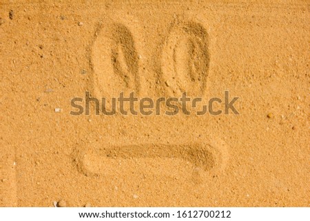 So so face images  emotion Draw on the sand and nature