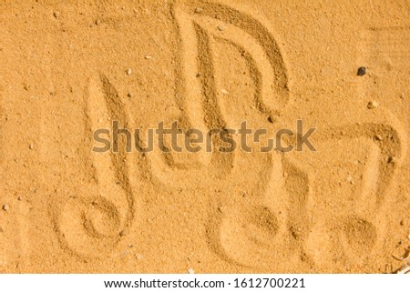 Music notes images Draw on the sand and nature