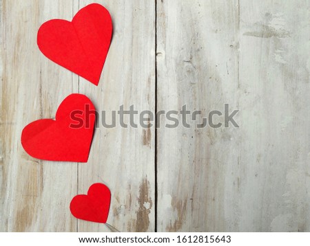 Valentine's day red heart on white wooden background. Holidays card with copy space .