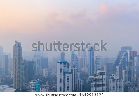 PM 2.5 and Dust in the air of Bangkok city, Capital city are covered by heavy smog, Misty morning in downtown, Bad air pollution, The Place to risk of cancer, Thailand-Image Royalty-Free Stock Photo #1612913125