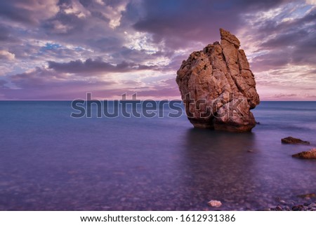 Love beach. Aphrodite's Rock - Aphrodite's birthplace near Paphos City. Cyprus island at sunset