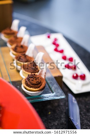 Picture of the chocolate cream ball in biscuit tart decorated with luxuary style