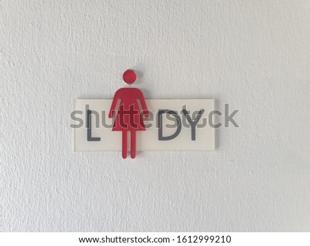 A basic toilet sign female