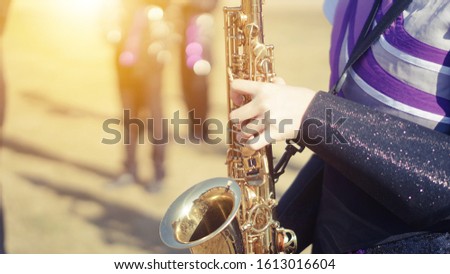 Young student Musician playing the Saxophone with Music practice of Band, Musical concept