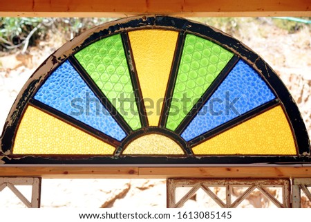 beautiful wooden windows with colored glass in Jerusalem Israel