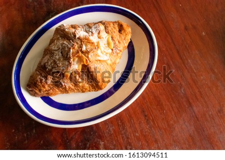 The pattern almond croissant on dish