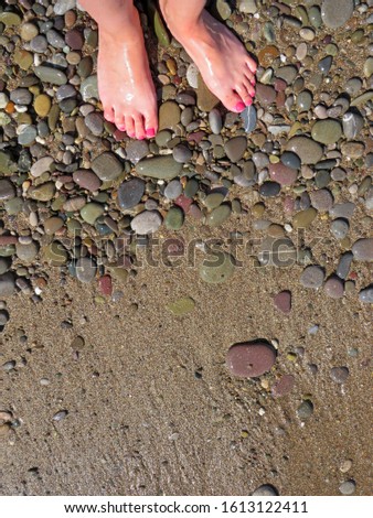 The texture of the water and sea sand. Step into the sea