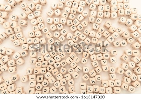 Alphabet letters. Flat lay image of randomly arranged latinic characters wooden cubes