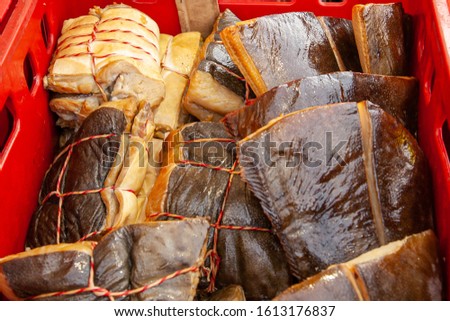 Sale of smoked Kamchatka fish. Far Eastern seafood, natural smoked fish - halibut salmon at the city Christmas market