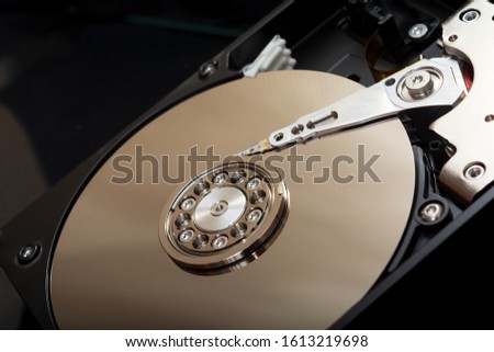 Internal parts of the hard drive. HDD. Computer memory. Modern technologies. Computer repair. Data storage concept. Black background. Free space for text. Recover lost data. Royalty-Free Stock Photo #1613219698
