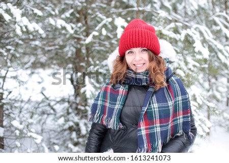 winter landscape and beautiful  girl with  carroty hair snow cold background