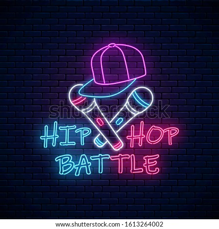 Hip hop battle neon sign with two microphones and baseball cap. Emblem of rap music. Dance contest advertisement design. Bright banner, logo. Vector illustration.