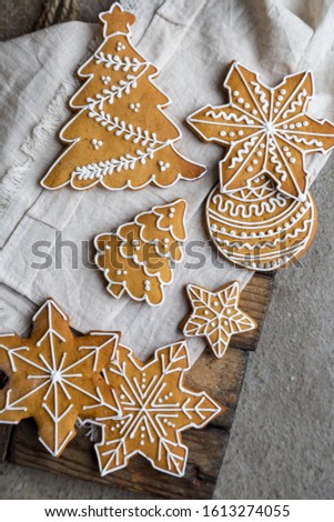 Different gingerbread cookies for new year. Concept of festive background for text. Gingerbread at concrete background for Chinese New Year and Christmas greeting card. Top view, table top