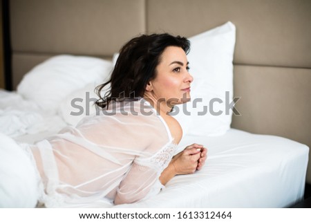 Pretty, young woman in her bed, fast asleep. Importance of sleep concept