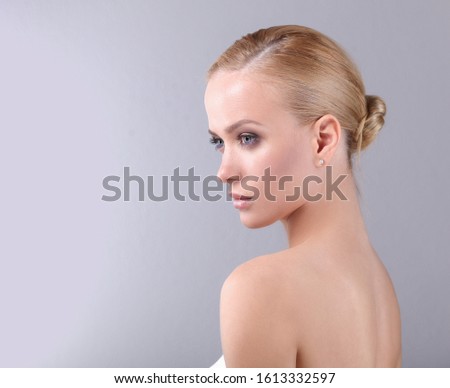 Beautiful face of young smiling woman with clean fresh skin