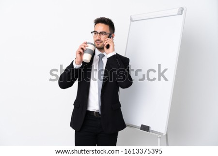 Businessman giving a presentation on white board