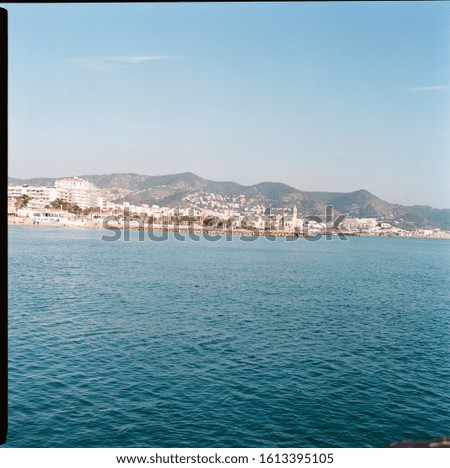 Sea with dutch angle and view of Sitges