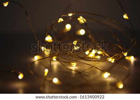 Copper wire white fairy lights Royalty-Free Stock Photo #1613400922