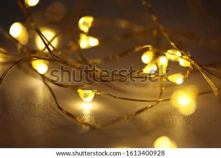Copper wire white fairy lights Royalty-Free Stock Photo #1613400928