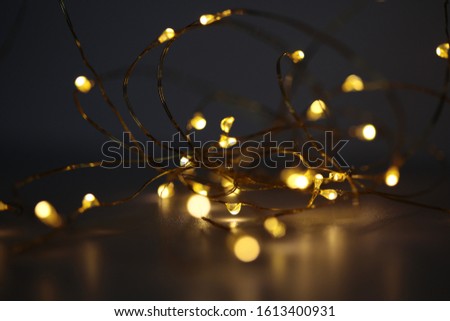 Copper wire white fairy lights Royalty-Free Stock Photo #1613400931