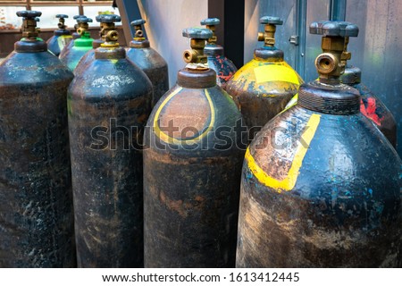 Cylinders for welding. Gas cylinders with welding mixtures. Propane. Acetylene. Carbonic acid. Equipment for welding. The job of a welder. Royalty-Free Stock Photo #1613412445