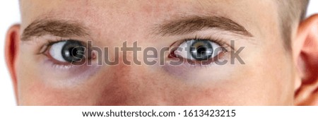 young man eye macro shoot, banner. panoramic photo of face
