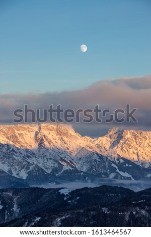 Panoramic sunset view moon Saalbach skiing Mountain moonrise dark mood