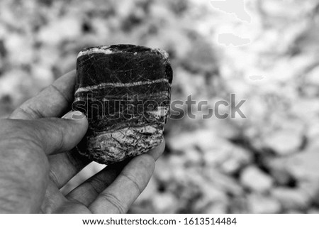 Stone in hand, black and white picture