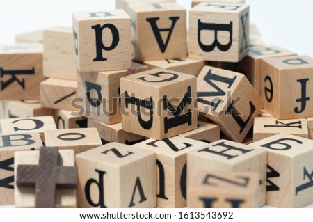 English alphabet cube wooden blocks for children learn and play for skill development. 