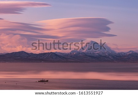 Kamchatka, the water area of Avacha Bay at sunrise, in the background the Vilyuchinsky volcano.