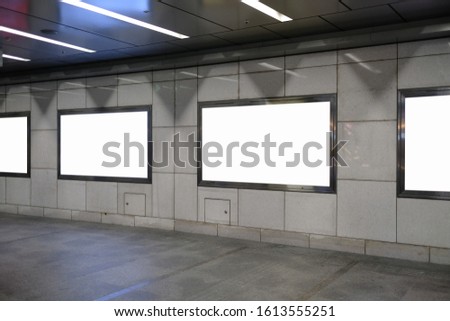 Blank billboard mockup near to escalator in  subway station.