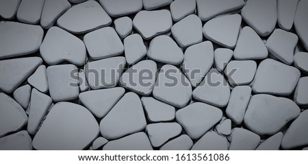 Dark gray or grey pattern of stone wall for background in vintage tone. Art and Textured wallpaper concept.  