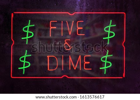 Vintage Neon Five and Dime Sign in Rainy Window