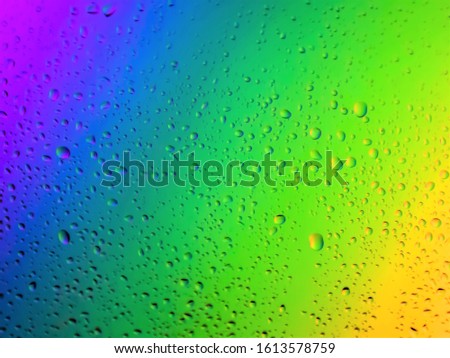colorful water drops on glass background.Abstract Background.