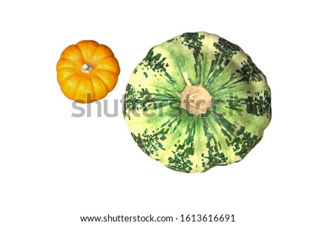 Ripe green autumn patisson, and small pumpkin, yellow, lie on a reed mat. View from above. Harvest concept. Isolated