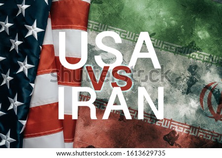 USA vs or versus IRAN - inscription over American flag and Iranian flag on grunge background. Problems and conflict with relationships between two countries concept.