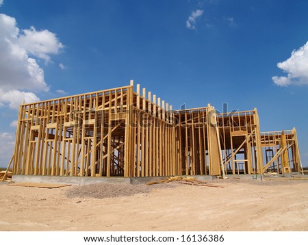 Construction site with an unfinished house frame. Horizontally framed photo.