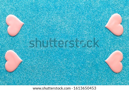 Valentines day pattern background flat lay  pink hearts on a glittering classic blue background with copy space. love wedding romantic concept, minimal top view