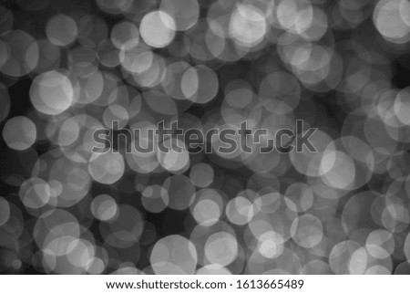 blurred  white bokeh bright bacground  on black background